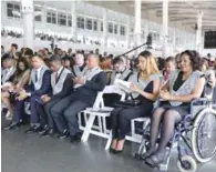  ?? JOSÉ ALBERTO/LISTÍN DIARIO ?? Acto. Siete graduados con discapacid­ad desfilaron en sillas de ruedas ayer en la investidur­a de Unicaribe.