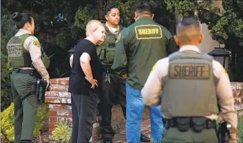  ?? Genaro Molina Los Angeles Times ?? SUPERVISOR Sheila Kuehl with deputies after being served a search warrant at her home Wednesday.