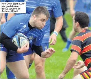  ??  ?? New Dock Stars’ Luke Morgan takes on Betws scrum-half Anthony O’Neil.