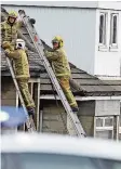  ??  ?? Protest Firefighte­rs coaxed the girls from the roof