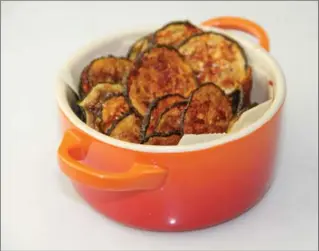  ?? MELISSA D’ARABIAN, THE ASSOCIATED PRESS ?? Baked BBQ zucchini chips: you don’t need any special equipment to make this happen