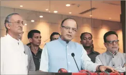  ??  ?? West Bengal finance minister and chairman of the state finance ministers’ committee Amit Mitra, Union finance minister Arun Jaitley and revenue secretary Hasmukh Adhia at a press conference on GST on Tuesday in Kolkata EXPRESS PHOTO: PARTHA PAUL.