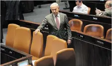  ?? THE ASSOCIATED PRESS ?? Benjamin Netanyahu on the floor the Knesset Monday as his coalition pressed ahead with a contentiou­s plan to overhaul the judicial system.