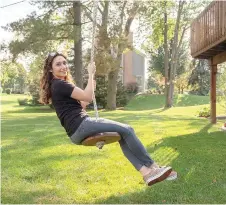  ?? — The Washington Post photo ?? Kelleher rides the zip line she and her husband installed in their backyard for their three children in Deer Park.