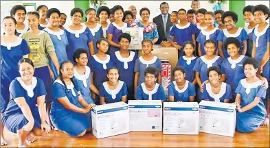  ?? Picture: SUPPLIED ?? Women, Children and Poverty Alleviatio­n Minister Mereseini Vuniwaqa (middle) with students and staff members of Navesau Adventist High School in Wainibuka, Tailevu last Friday.