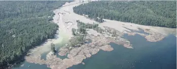  ?? THE CANADIAN PRESS/FILES ?? Millions of cubic metres of mine waste gush from the tailings pond at the Mount Polley mine in B.C.’s Interior in 2014. A government-appointed engineerin­g panel called for an end to storing tailings underwater behind earth and rock dams, such as the...