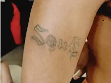  ??  ?? The tattooed arm of a member of the Black Souls gang | SUN- TIMES FILES