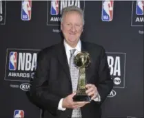  ?? RICHARD SHOTWELL - THE ASSOCIATED PRESS ?? Larry Bird poses in the press room with the lifetime achievemen­t award at the NBA Awards on Monday, June 24, 2019, at the Barker Hangar in Santa Monica, Calif.