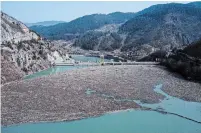  ?? KEMAL SOFTIC THE ASSOCIATED PRESS ?? Weeks of wet winter weather had flooded the Drina River with garbage near Visegrad in eastern Bosnia on Wednesday.