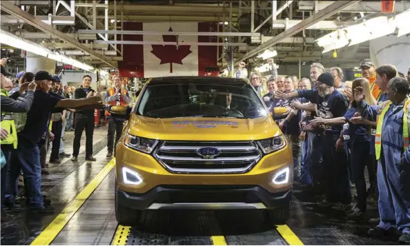  ?? Chris Young/ThE CAnADiAn PrEss filEs ?? A new report says U.S. auto tariffs would likely result in outcomes that “are all profoundly negative for consumers, ... and for overall U.S. economic output and employment levels.” Canada is expected to face higher costs, too, despite tariff exemptions.