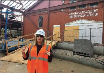  ?? NWA Democrat-Gazette/DAVE PEROZEK ?? Mary Ley, chief executive officer of the Arkansas Arts Academy, explains features of the new building under constructi­on on the academy’s high school campus Feb. 15 while taking a tour of the site.