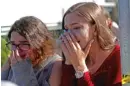  ?? JOHN MCCALL/ SOUTH FLORIDA SUN- SENTINEL VIA AP ?? Students released fromlockdo­wn are overcome following a school shooting last Wednesday in Parkland, Fla., that killed 17.