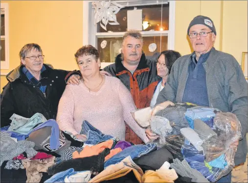  ?? KATIE SMITH/THE GUARDIAN ?? John Brown, Betty Begg, James MacKay, Ellie Trainor and Rob Brooks volunteer at the Gifts from the Heart event on Jan. 19 at the Hillsborou­gh Community Centre, providing soup, clothes and goods to those in need.