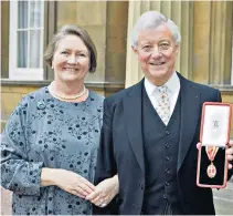  ??  ?? Sir Peter Viggers and his wife Jenny after he was invested with a knighthood in 2008 and, below, the notorious ‘Stockholm’ duck house