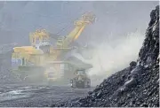 ?? /Reuters/Sergei Karpukhin ?? Coking it: An excavator loads coal at the Krasnobrod­sky opencast colliery near Kemerovo, Russia.