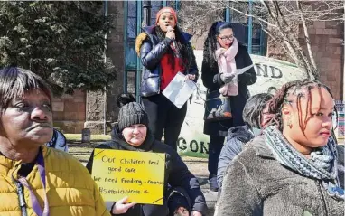  ?? Ned Gerard/Hearst Connecticu­t Media ?? Katherine Lantigua, of K Colorful Daycare in Bridgeport, leads a Morning Without Child Care rally at McLevy Green in Bridgeport on Wednesday.