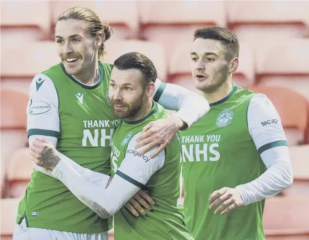  ??  ?? 2 Martin Boyle celebrates with Jackson Irvine and Kyle Magennis after giving Hibs a 2-0 lead at Tannadice on Saturday. Inset left, Kevin Nisbet
