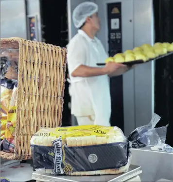  ?? PHOTO: JASON BOUD/AFRICAN NEWS AGENCY (ANA) ?? Charl Smith from the National Regulator for Compulsory Specificat­ions carries out spot checks whether the various brands of bread are complying with the minimum weight requiremen­t. Bread is VAT zero-rated in South Africa.