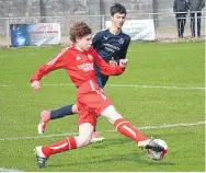  ??  ?? A Brechin player (red) glides past his man in the 4-1 Chuck McGowan Cup Final loss to Carnoustie.