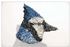 ?? RALPH BARRERA / AMERICAN-STATESMAN ?? “Blue Jay,” created by Austin artist Shawn Smith, is a hand
built “pixelated” sculpture (made of tiny cubes of wood) at Grayduck Gallery on Cesar Chavez Street. His exhibit, “Predators, Prey and Pixels: Shawn Smith,” runs through Oct. 18.