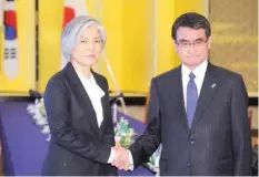  ?? — AFP ?? South Korean Foreign Minister Kang Kyung-Wha (L) with her Japanese counterpar­t Taro Kono in Tokyo on Tuesday.