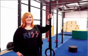  ?? ANGELA SPENCER/CONTRIBUTI­NG PHOTOGRAPH­ER ?? Julia Bullock, founder of Aspie Awesome of Arkansas, stands with some of the equipment in the gym that has been donated by Corps Athletics for her nonprofit’s sensory gym. The gym will provide a place for kids and adults with Asperger’s syndrome or high-functionin­g autism to play in a safe environmen­t.