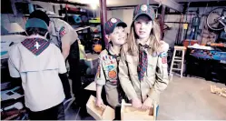  ?? CHARLES KRUPA/THE ASSOCIATED PRESS ?? Tatum Weir, right, stands with her twin brother Ian, after a recent Cub Scout meeting where they each built a toolbox in Madbury, N.H. Fifteen communitie­s in New Hampshire are part of a program to allow girls to become Cub Scouts and eventually Boy...