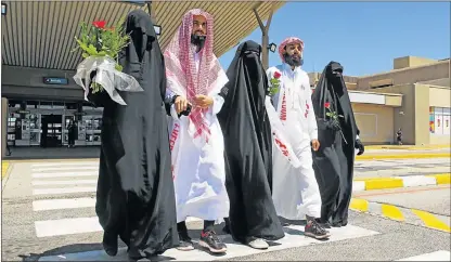  ?? Picture: BAZIL RAUBACH ?? FREEDOM WALK: Desai family members leave the airport yesterday. They are, from left, former detainee Huda, 34, newly released Shah Waseeullah, 25, youngest sister Safa, 19, former detainee Shah Waliyullah, 28, and Irfanah, 23