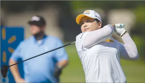  ?? NWA Democrat-Gazette/JASON IVESTER ?? Inbee Park hits from the eighth tee box Wednesday with her pro-am group during the Walmart NW Arkansas Championsh­ip presented by P&G at Pinnacle Country Club in Rogers.