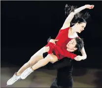  ?? AP PHOTO/FELIPE DANA ?? Tessa Virtue and Scott Moir of Canada perform during the figure skating exhibition gala in the Gangneung Ice Arena at the 2018 Winter Olympics Sunday.