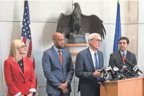  ?? KEEGAN KYLE / USA TODAY NETWORK-WISCONSIN ?? State Treasurer-elect Sarah Godlewski (from left), Lt. Gov.-elect Mandela Barnes, Gov.-elect Tony Evers and Attorney General-elect Josh Kaul hold a news conference in Madison on Wednesday to address the legislatio­n that was passed limiting the power of the governor and attorney general.