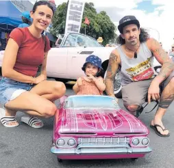  ?? Photo / Alison Smith ?? Rachel and Josh with daughter Sophia Trybula with the 59 Impala that Josh built for his daughter before she was born.