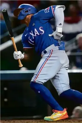  ?? GODOFREDO A. VÁSQUEZ/ASSOCIATED PRESS ?? The Rangers are hoping for good news when Adolis Garcia undergoes an MRI after clutching at his back in Game 3.