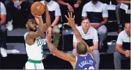  ?? Kim Klement / Associated Press ?? The Celtics’s Kemba Walker (8) shoots over the 76ers’ Al Horford (42) on Friday night.