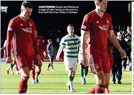 ??  ?? CHASTENING: Devlin and McKenna trudge off after being on the end of a first-half blitz from Celtic in October