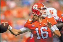  ?? KEN RUINARD/ POOL PHOTO VIA AP ?? Clemson quarterbac­k Trevor Lawrence makes a pass against Syracuse in Clemson, S.C., on Saturday.