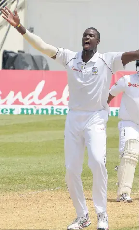  ?? IAN ALLEN/PHOTOGRAPH­ER ?? West Indies captain Jason Holder celebrates after capturing another Bangladesh­i wicket on the third day of the second Test at Sabina Park on Saturday.