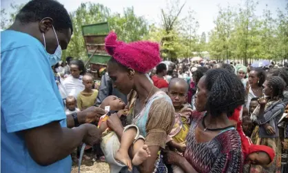  ?? Photograph: Christine Nesbitt/AP ?? A child is screened for malnutriti­on in Tigray. Ethiopia's government has imposed what the UN calls ‘a de facto humanitari­an aid blockade’ in the region.