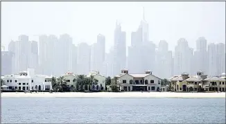  ??  ?? In this file photo, Jumeirah Palm Island luxury villas are seen by their private beaches in Dubai, United Arab Emirates. Expo 2020 is unlikely to improve the dire conditions of Dubai’s real estate market, S&P Global Ratings said.
(AP)