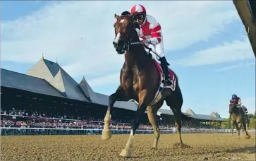  ?? Skip Dickstein Albany Times Union ?? SONGBIRD, with Mike Smith aboard, outruns the field at the Coaching Club American Oaks at Saratoga.