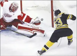  ?? CP PHoTo ?? Detroit Red Wings goalie Jared Coreau can’t get his glove on the puck on a goal by Boston Bruins left wing Brad Marchand.