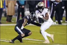  ?? CHRIS SZAGOLA — THE ASSOCIATED PRESS ?? The Saints’ Alvin Kamara (41) is tackled by Eagles’ defensive back Darius Slay (24) Sunday in Philadelph­ia.