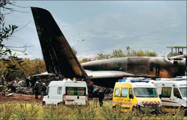  ?? ANIS BELGHOUL / ASSOCIATED PRESS ?? An Algerian military plane is seen after crashing near an airport outside Algiers, Algeria, on Wednesday.