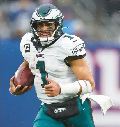  ?? AL BELLO/GETTY ?? Quarterbac­k Jalen Hurts, shown in December, and the Philadelph­ia Eagles look like good bets to return to the Super Bowl.