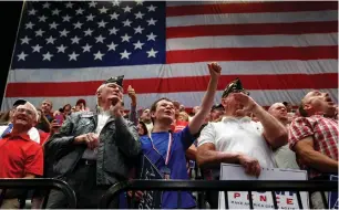  ?? (Scott Morgan/Reuters) ?? SUPPORTERS CHEER as President Donald Trump speaks during a rally at the US Cellular Center in Cedar Rapids, Iowa, yesterday.