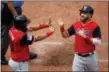  ?? CHARLIE RIEDEL — THE ASSOCIATED PRESS ?? Melky Cabrera, left, and Jason Kipnis celebrate after scoring on a two-run single by Francisco Lindor during the sixth inning.