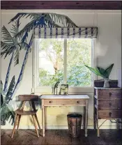  ?? ?? Want to bring the ocean vibe inside? Interior designer Ingrid Weir advises using art, as with this palm tree mural she based on a thrift store painting.