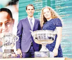  ?? — AFP photo ?? Nadal poses with Latvia’s Jelena Ostapenko after the official draw ceremony for the Roland Garros 2018 French Tennis Open in Paris.