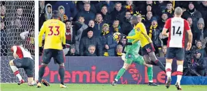  ??  ?? Gloving it: Abdoulaye Doucoure appears to palm the ball past Alex McCarthy, the Southampto­n goalkeeper, to equalise for Watford in the 90th minute