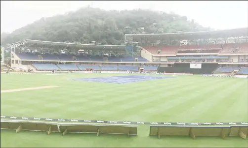  ??  ?? The playing area at the Grenada National Stadium remained under covers for most of yesterday.